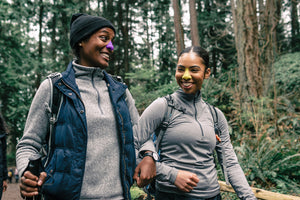 Two women smiling wearing Noz vegan cruelty free sunscreen while hiking