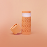 Load image into Gallery viewer, Reef safe Nözscreen in orange with orange gradient background 
