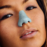 Load image into Gallery viewer, Close up of model wearing blue Nözscreen on her nose
